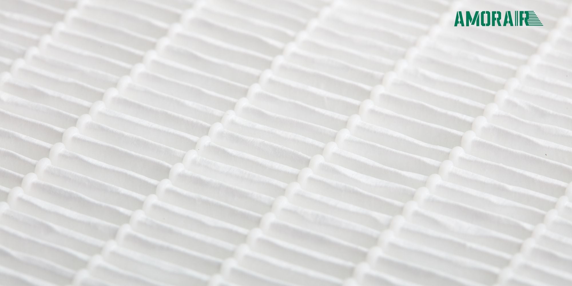 Close-up of a white air filter with 'AMORAIR' branding.